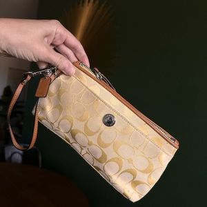 Coach yellow and tan wristlet